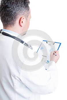 Hospital manager reading financial charts and sales prediction