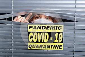 Hospital quarantine or isolation of patient standing alone in room with hopeful for treatment of Coronavirus COVID-19