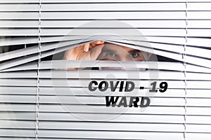 Hospital quarantine or isolation of patient standing alone in room with hopeful for treatment of Coronavirus COVID-19