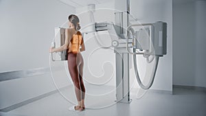 Hospital Radiology Room: Beautiful Multiethnic Woman Standing Topless in the X-Ray Machine. Adult