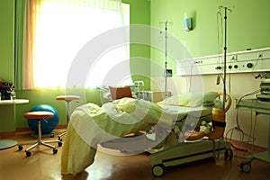 A hospital room with a bed and some equipment