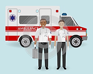 Hospital staff concept. Paramedics ambulance team on ambulance car background. Emergency medical serviice employee.