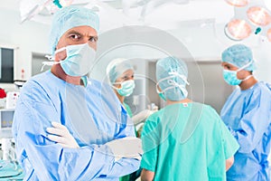 Hospital surgeons operating in operation room