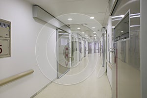 Hospital surgery area with white walls.