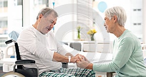 Hospital, talking and woman visit man for comfort, care and support for wellness, service and surgery. Healthcare