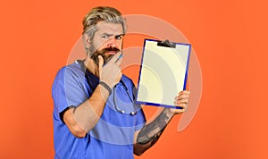 Hospital treatment. Coronavirus concept. Man bearded doctor with folder. Seek urgent medical attention. Medical