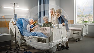 Hospital Ward: Grandfather Resting in Bed, His Caring Beautiful Grandmother Sitting Beside, Happy