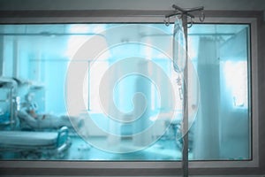 Hospital ward with observation window and intravenous drip on th