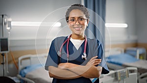 Hospital Ward: Portrait of Posing Beautiful Black Female Head Nurse, Doctor, Surgeon Smiles Charmi