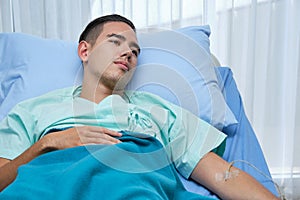 Young Cacausian male Patient Lying on Bed