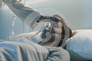 Hospitalized patient lying in a bed