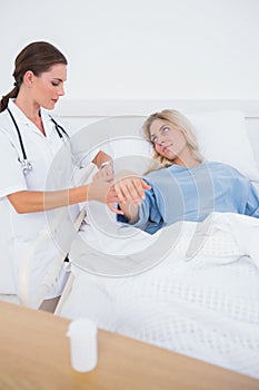 Hospitalized woman lying in sickbed