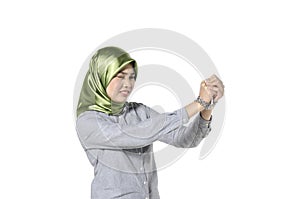 Hostage and freedom concept, hijab women hand in chain isolated