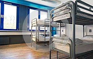 Hostel interior, bunk beds and linen, nobody photo