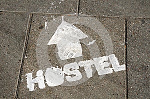 Hostel sign on the ground