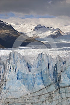 Hostile glacier Perito Moreno with mountain background