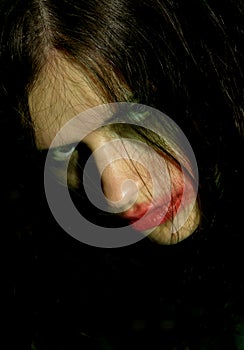 Hostile look of a young woman with psychical problems photo