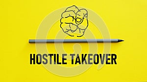 Hostile takeover is shown using the text and picture of the fist