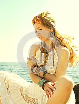 Hot african style fashion portrait of a beautiful young sitting woman with headband