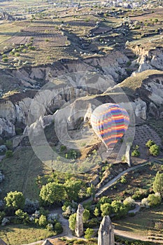 Hot air ballon over Love Valley near Goreme and Nevsehir in the center of Cappadocia, Turkey region of Anatolia