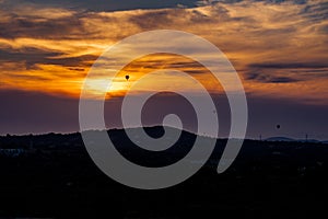 Hot air ballons in the sky at dusk