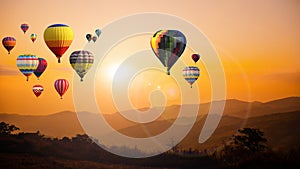 Hot air balloon above high mountain at sunset