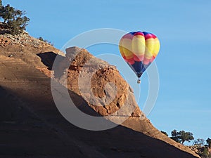 Hot Air Balloon beyond the Redrocks.