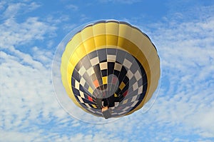 Hot-air balloon on the bsckground of the blue sky.