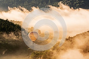 Hot air balloon floating in the morning light