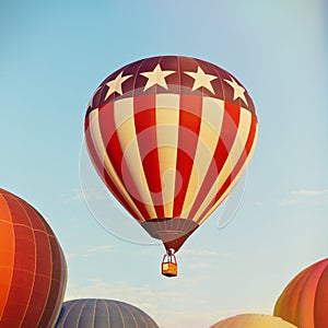 Hot air balloon flying over blue sky photo