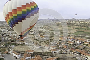 Hot Air balloon flying over a city