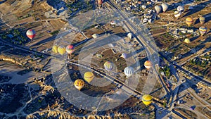 Hot air balloon flying over rock landscape at Cappadocia Turkey