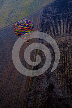 Hot Air Balloon flying over winter fields