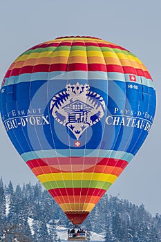 Hot Air Balloon flying in the sky. Hot air ballooning with mention pays d\'enhaut. Balloon festival