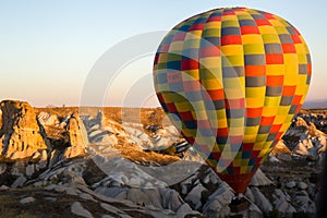 Hot air balloon flying at sunrise