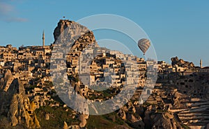 Hot air balloon over ancient town