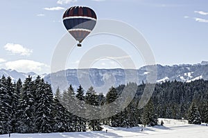 Hot air balloon over cross-country skiing