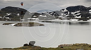 Hot air balloon over the famous County Road 55 norway