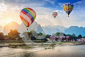 Hot air balloon over Nam Song river at sunset in Vang vieng, Laos