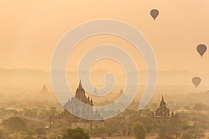 Hot air balloon over plain of Bagan in misty morning before sunrise, Myanmar