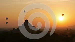 Hot air balloon over plain of Bagan at sunrise, Myanmar