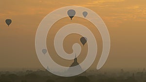 Hot air balloon over plain of Bagan at sunrise, Myanmar