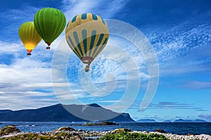 Hot air balloon over sea, Geiranger, Norway.