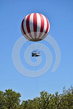 Hot air balloon over the trees in Budapest city