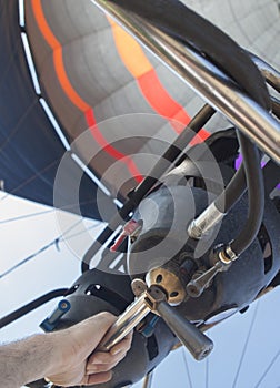 Hot air balloon pilot operating the burners