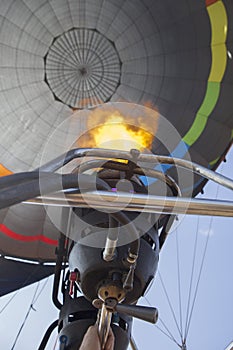 Hot air balloon pilot operating the burners