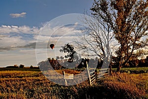 A Hot, Air Balloon Punctuates a Picturesque Fall Landscape