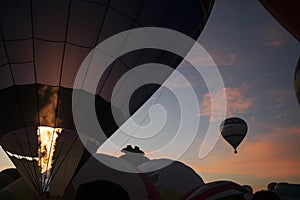 Hot air balloon purple rise up sky at dawn photo