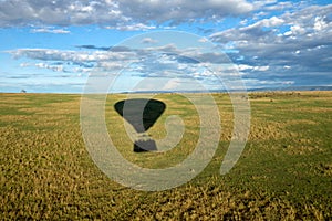 Hot air balloon ride on the big green plains of masai mara in kenya/africa.