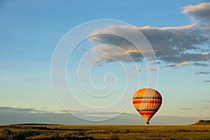 Hot air balloon ride on the big green plains of masai mara in kenya/africa. photo